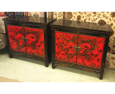 SIDE CABINETS, a pair, Chinese black and red lacquered with a pair doors having dragon decoration enclosing a shelf, 99.5cm W