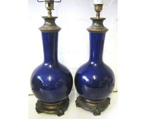 TABLE LAMPS, a pair, Continental blue ceramic of bottle form with patinated metal mounts, plus shades, 56cm H. (2)