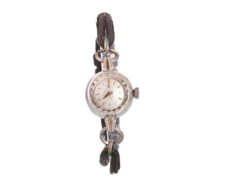 OMEGA, EIGHTEEN CARAT WHITE GOLD MANUAL WIND WRIST WATCH, the round dial with baton hour markers, 16mm case, on a black leath