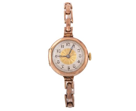 NINE CARAT GOLD MANUAL WIND WRIST WATCH, the round dial with Arabic hour markers, 24mm case, on a nine carat gold exanding br