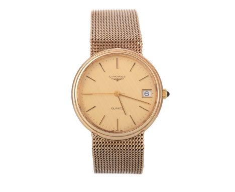 LONGINES, NINE CARAT GOLD QUARTZ WRIST WATCH, the round dial with baton hour markers, 34mm case, on a nine carat gold bracele