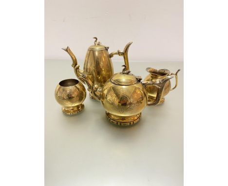 A Victorian brass engraved four piece tea and coffee service in grey floral sprays and swan finial's complete with sugar basi