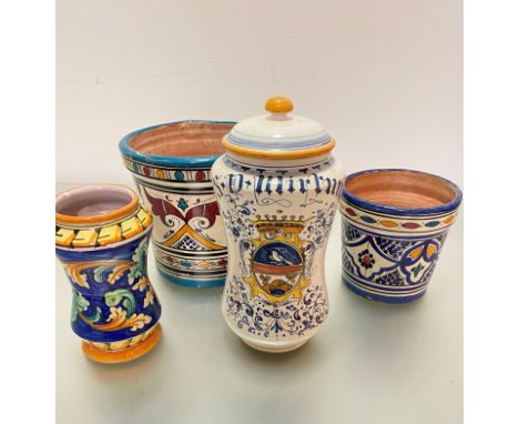 A modern Albarello Italian drug jar with crested centre and a similar decorated miniature vase, two Moroccan style pottery pl