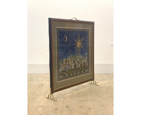 A late 20th century fire screen, with brass panel, glazed aperture with embroidered panel, raised on brass splayed supports, 
