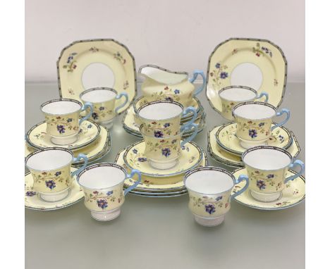 A Paragon china 1920's / 30's, 32-piece tea service with handpainted enamel floral sprays, with blue and black decorated bord
