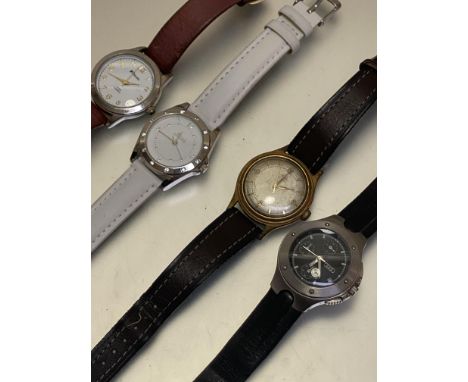 A collection of watches including a Revel quartz watch on leather strap, a Secret Dreams watch on white strap, a gent's Avia 