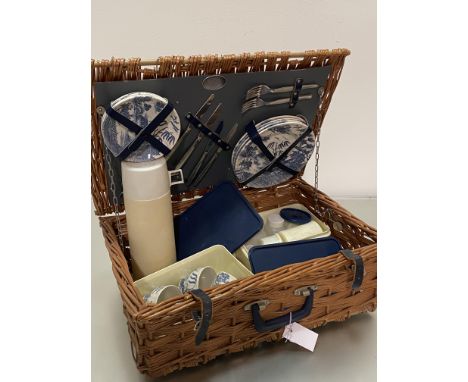 A Brexton collection handmade England wicker picnic basket complete with original Thermos flask, Tupperware tubs, blue and wh