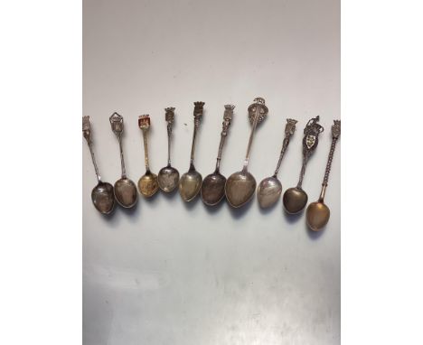 A collection of nine various souvenir tea spoons including Paris, Playe, Nice, Arras, etc some stamped as sterling silver, ot