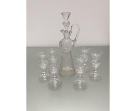 A crystal thistle shaped liquor decanter and a set of six matching glasses, all decorated with thistle design, (decanter h 23