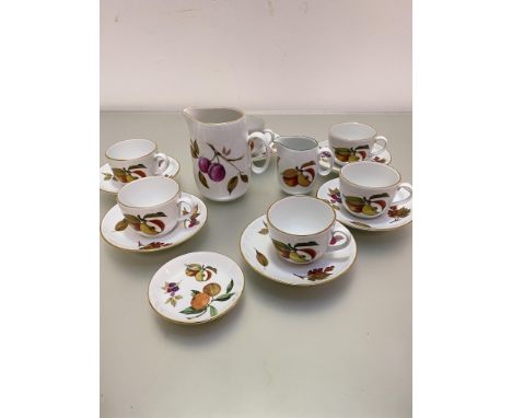 A Royal Worcester Evesham oven to tableware set of six teacups and saucers, a large milk jug, a smaller milk jug and a dish, 