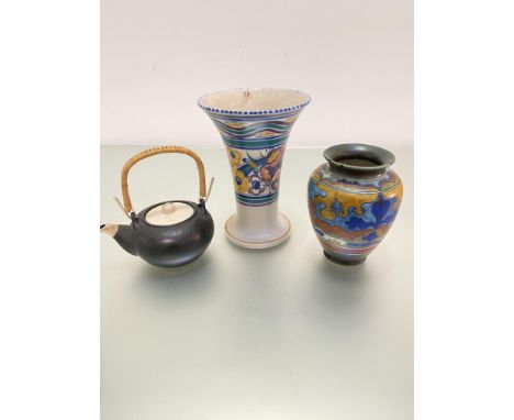 A Poole pottery flared neck 1920's vase decorated with stylised floral border, (h 23cm x 16cm), a Gouda Ware baluster vase, a