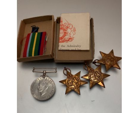 A set of World War II General Service medals awarded to R Charmers including Pacific Star, The Atlantic Star, The 1939-45 Sta