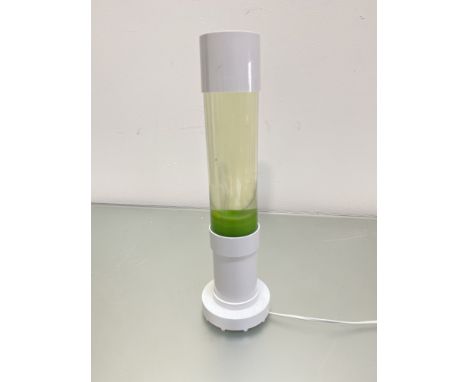 A modern white plastic lava style lamp on circular moulded base, (h 40cm x 8cm)