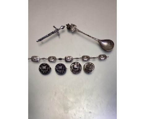 An Edinburgh silver Viking long boat panel bracelet, (approximate w 7 cm L 17cm), a Claymore, Birmingham silver circular Viki