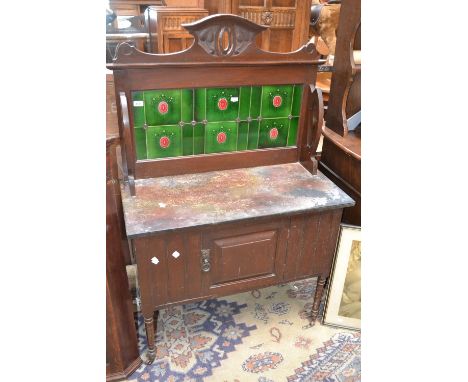 An Art Nouveau tile back washstand, rouge marble top, single door cupboard to base