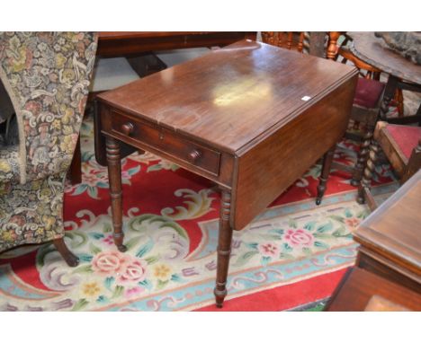 A George III mahogany Pembroke table,rounded rectangular top, drawers to both ends, button handles, turned legs, ceramic cast