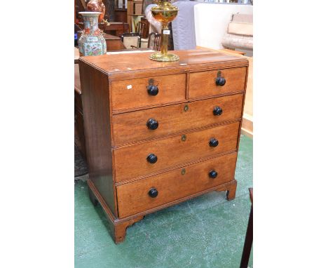 A George III oak chest of drawers, caddy top, two short over three graduated long drawers, ogee feet, 103cm high x 92cm wide.