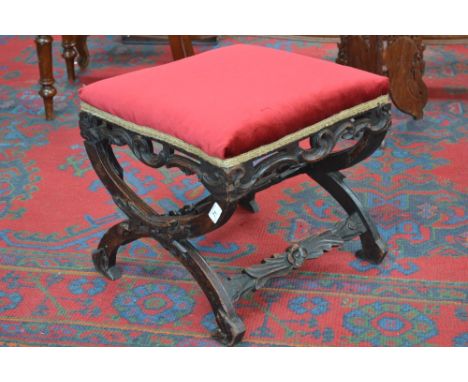 A Victorian carved oak X-frame stool