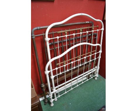 A Victorian white painted bed; a Victorian brass and iron bed