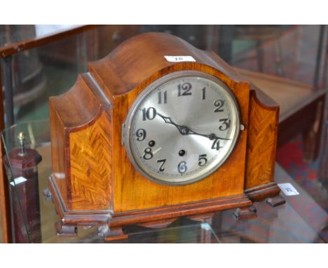 A 1930's mahogany inlaid mantel clock, Westminster chime, Arabic numerals, three winding holes.