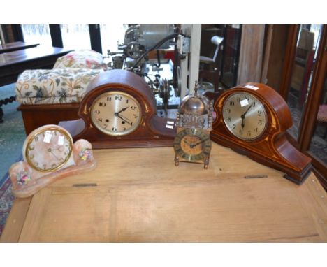 A brass lantern clock; an Edwardian mahogany mantel clock; another; an alabaster mantel clock (4)