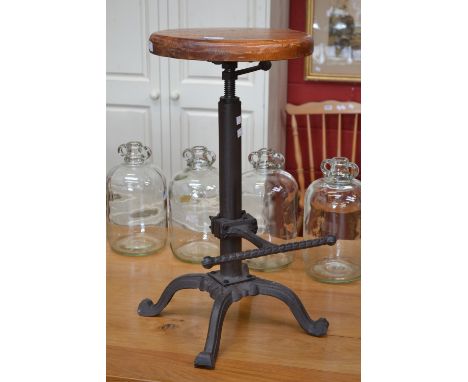 A metalwork rise and fall stool with teak seat