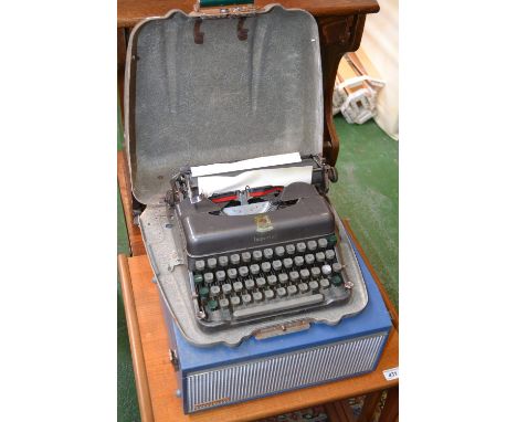 An Imperial typewriter, in fibreglass case; a Marconiphone twin track tape recorder, model 4202