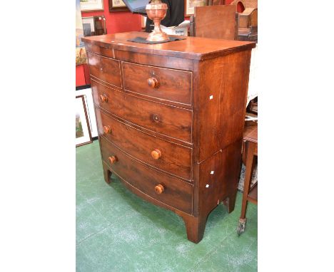 A Victorian mahogany bow front chest, of two shirt and three long graduated cockbeaded drawers, turned wooden handles, c.1860