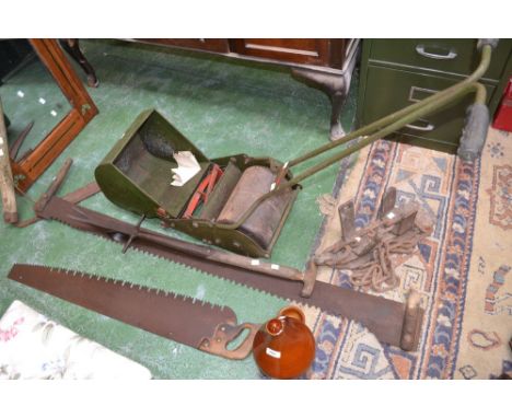 Vintage tools - a scythe, a dock lifter, two cross cut saws, an anti skid cart slipper, a small Webb mower, a chicken drinker