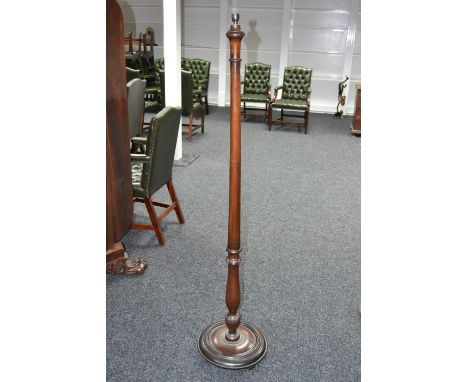 A mahogany standard lamp, spreading cylindrical column, baluster lobed terminal, circular base