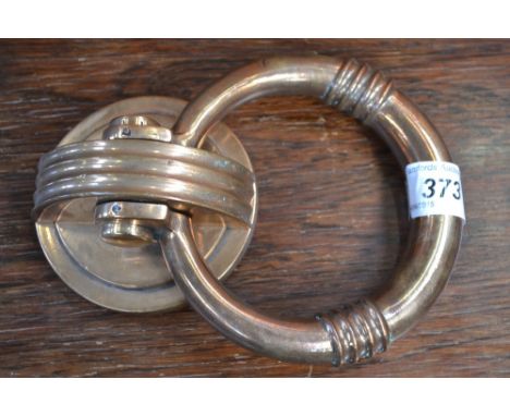 A 1920's-30's deco brass door knocker