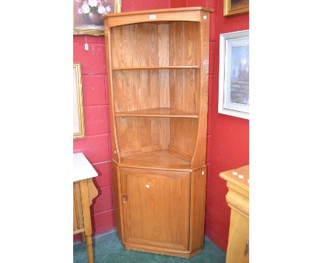 An Ercol floor standing corner cupboard