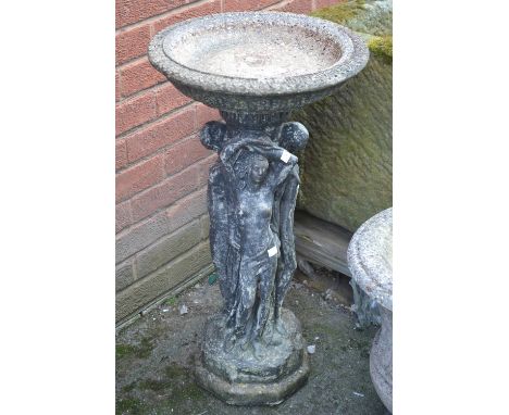 A 20th century reconstituted stone bird bath, the pedestal cast with female figures