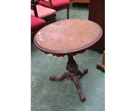 A Victorian walnut veneered tripod table, circular top, shaped apron, turned column, cabriole legs.