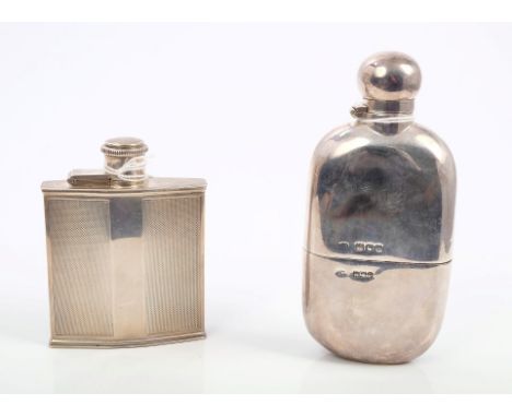 Late Victorian silver spirit flask of oval form, with hinged bayonet fastening cover and separate drinking cup (London 1900),