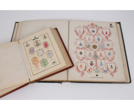 Two 19th century albums of crests and monograms, the first inscribed to the frontis pages and dated 1873, housing numerous ti