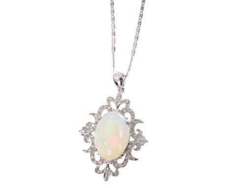 Opal and diamond pendant with an oval opal cabochon weighing approximately 6 carats, in diamond set white gold (18ct) mount, 