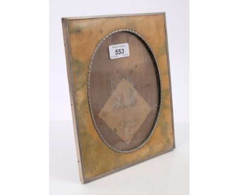 Edwardian silver mounted shagreen carved photograph frame of rectangular form, with engine-turned border and flower-head oval