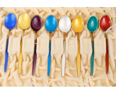 Set of eight Norwegian silver gilt and enamel coffee spoons, by D. Andersen Oslo, in a fitted case, each spoon a different co