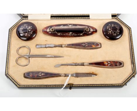 1920s silver and tortoiseshell mounted seven piece manicure set, comprising pair containers, nail buffer, nail file, two nail