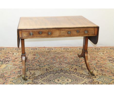 Regency mahogany satinwood boxwood and pen work inlaid sofa table, the rounded rectangular drop-leaf top inlaid with continuo