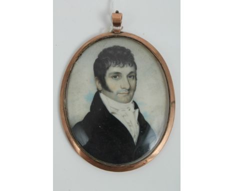 Early 20th century English School oval portrait miniature on ivory - a gentleman in black coat, in oval yellow metal frame, 6