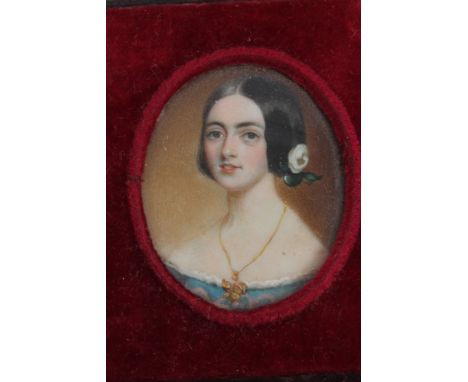 Early Victorian English School oval portrait miniature on ivory - a young lady with flower in her hair, in velvet-lined foldi