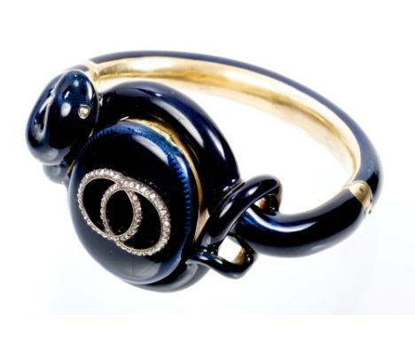 Fine Victorian diamond and blue enamel snake bangle with a central oval locket applied with two interlocking diamond circles 