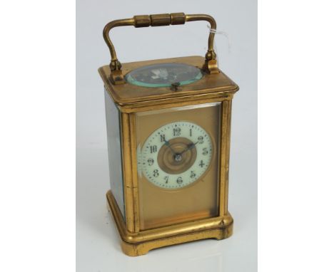 Late 19th century repeating carriage clock with gilt brass case of conventional form, with white enamel and brass dial, eight