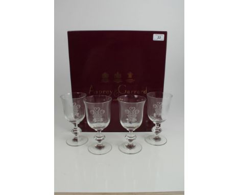 HRH The Prince of Wales - four Asprey & Garrard Presentation glass goblets with etched Prince of Wales feather crests, on kno