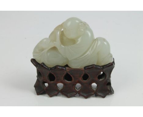 19th century Chinese pale celadon jade carving, carved and pierced as a reclining boy and duck with an entwining branch, 6.5c