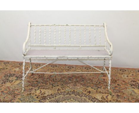 Wrought iron white painted garden bench with spiral-twist slate back and scroll arms on spread supports, 123cm wide