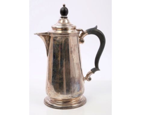 1920s silver coffee pot of tapering cylindrical form, with sparrow beak spout, ebony scroll handle and domed hinged cover wit