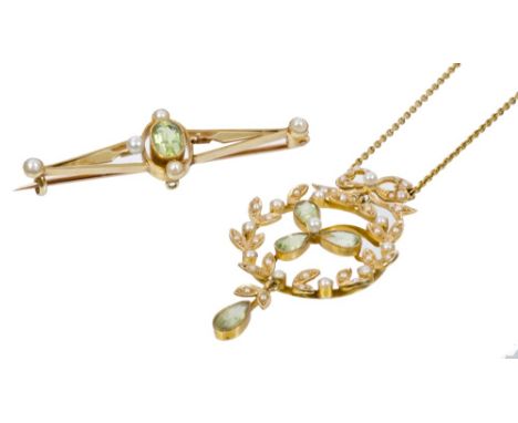 Edwardian peridot and seed pearl pendant with a flower-shaped cluster within a seed pearl garland, with pear-shape peridot dr